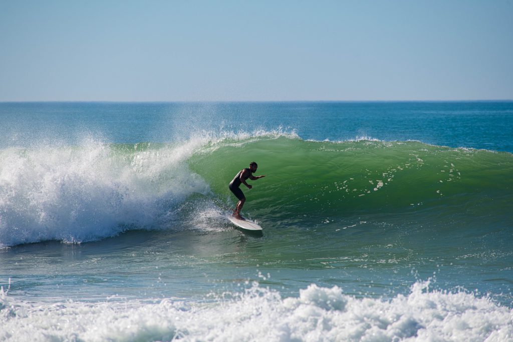 Surfing in action in a wave on the Basque coast